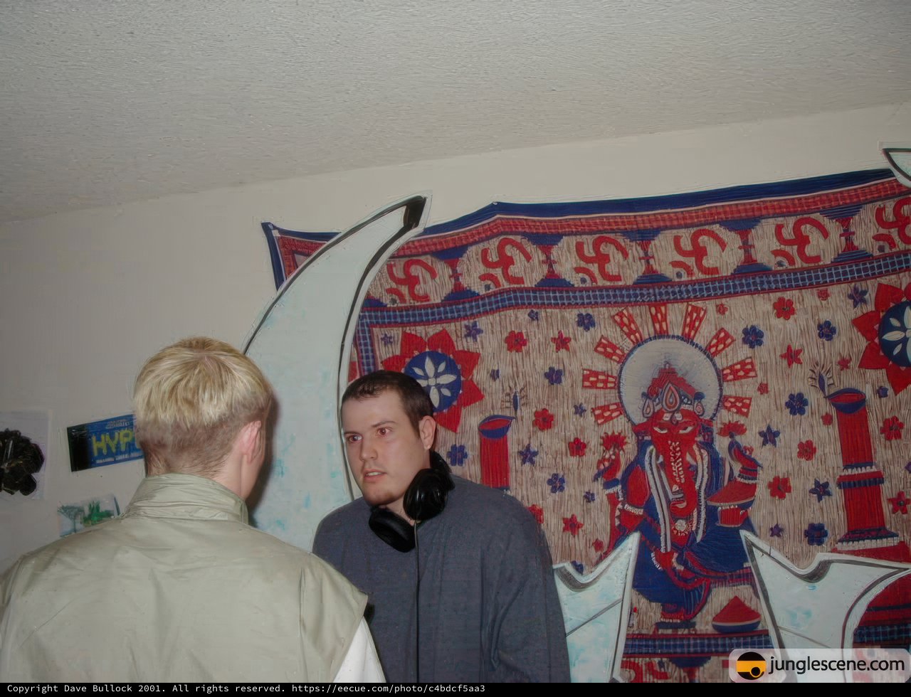 Two Men Contemplating Artwork