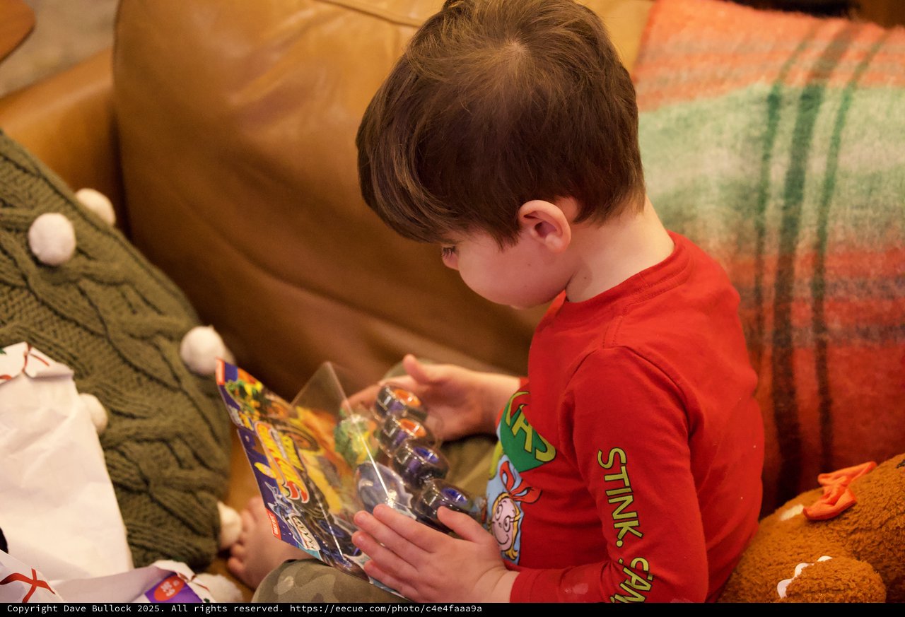 Child Opening Action Figure on Christmas Morning
