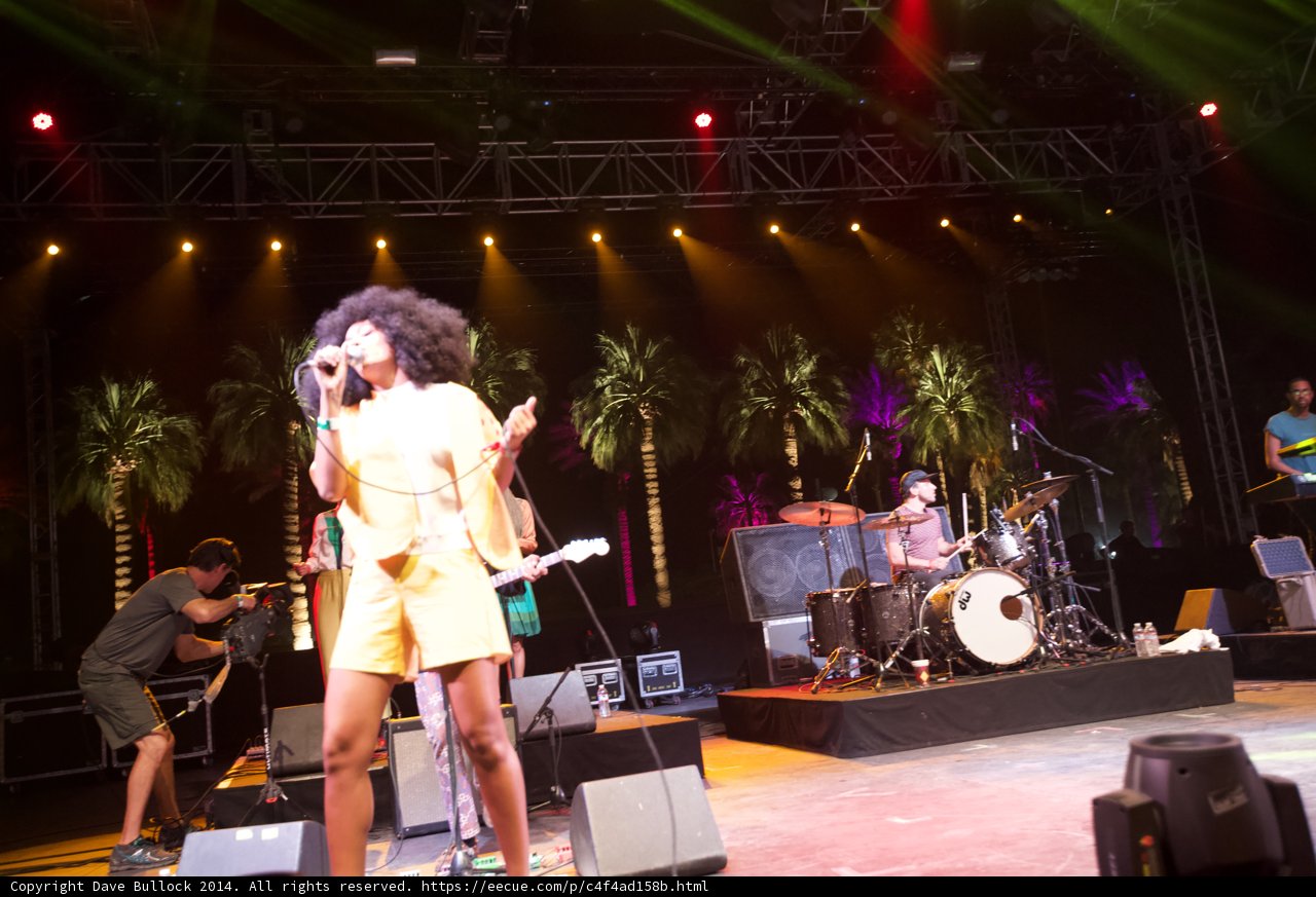 The Spotlight on the Yellow Dress Singer