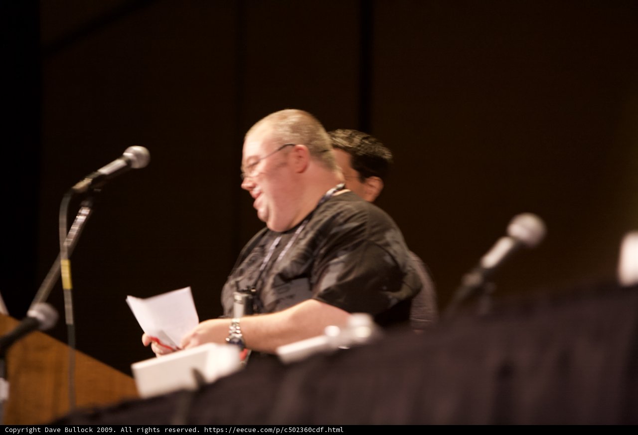 Man reading paper at Defcon 17