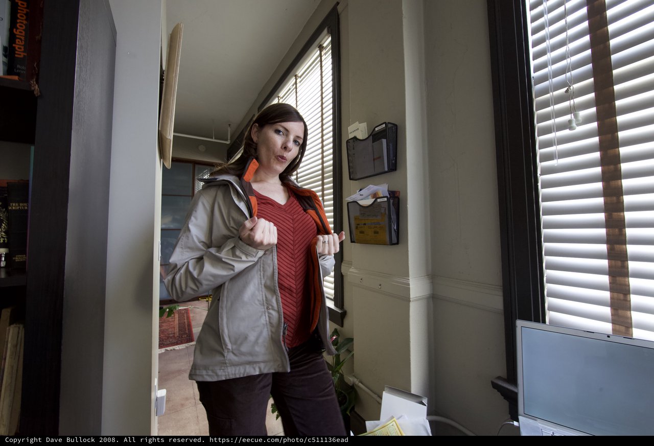 Woman in Doorway Arriving Home During Hanukkah