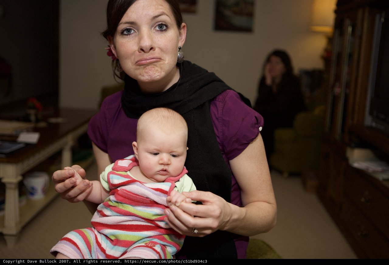 Mother and Baby Share Matching Exasperated Expressions