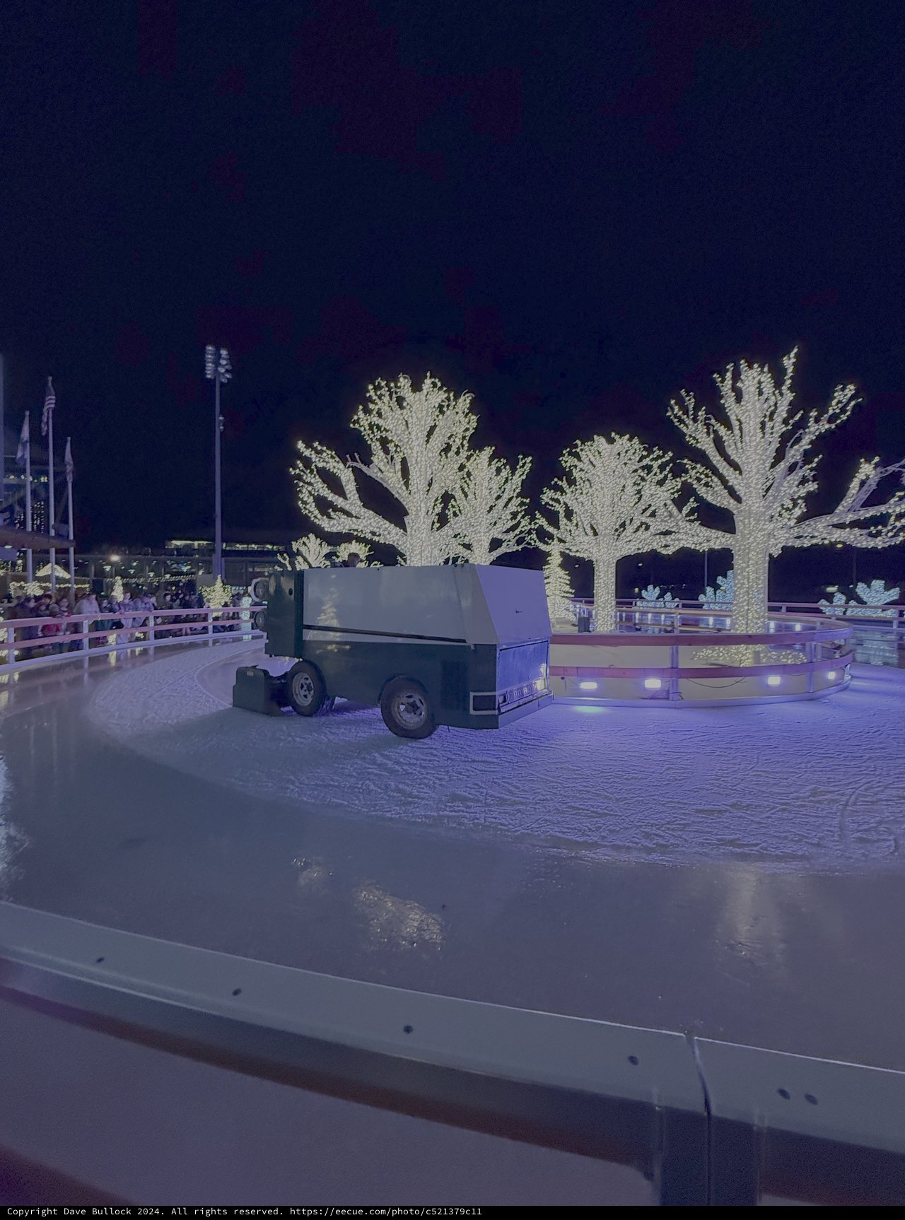 Ice Resurfacing Machine on Illuminated Winter Ice Rink