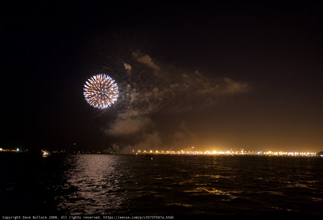 Explosive Fireworks Light Up the Night Over the Water