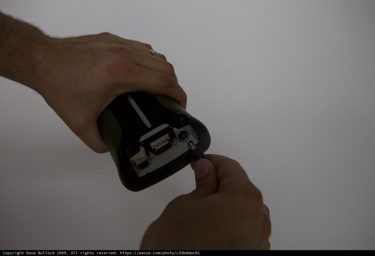 Tech-Savvy Man with Electronic Adapter