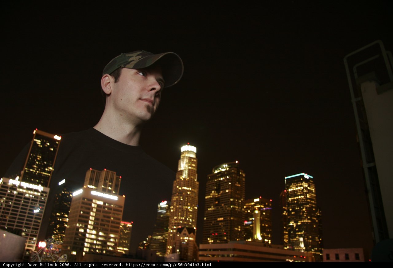 Nighttime cityscape with man in black shirt