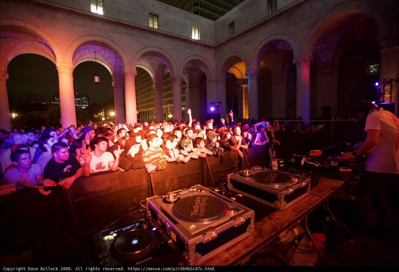 DJ Georgie Farmer performing for a crowded urban club