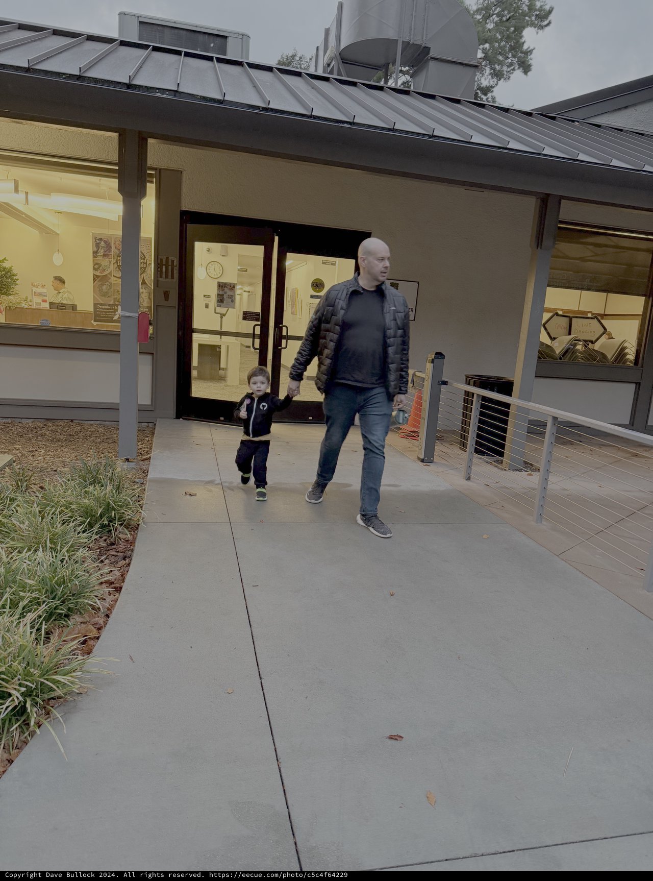 Father and Child Walking at Modern Museum