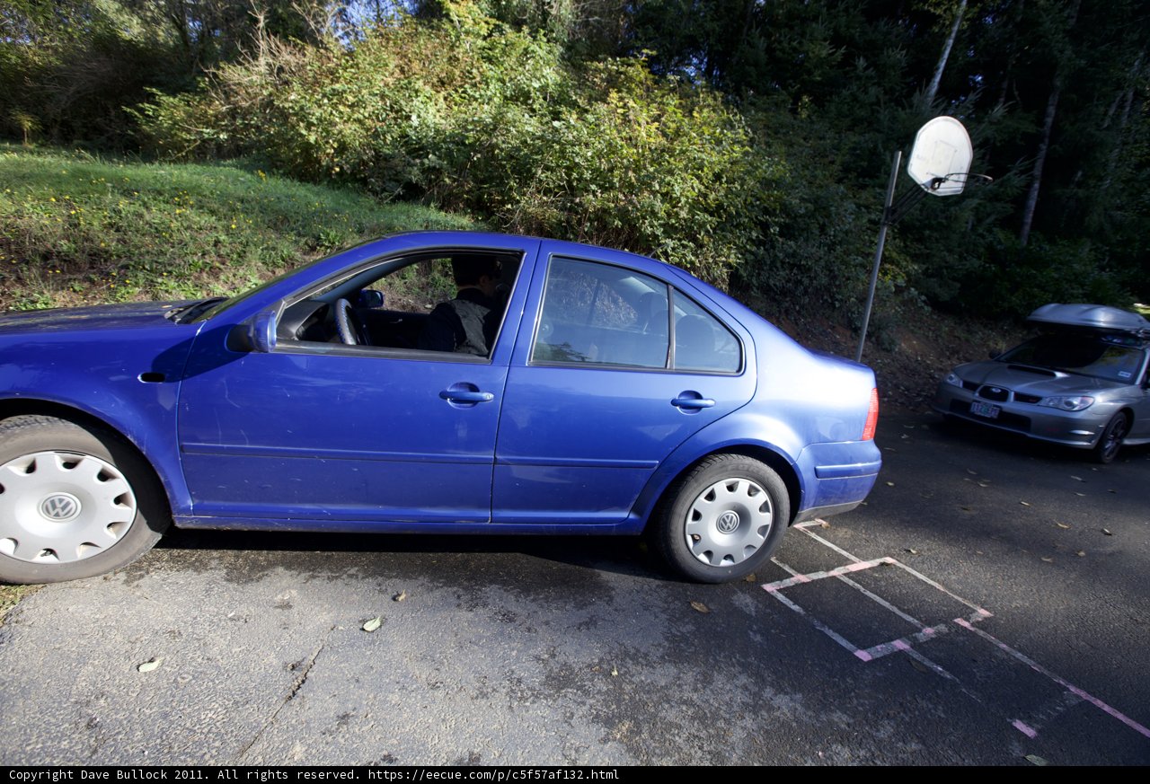 Blue Coupe Parked on the Side of the Road