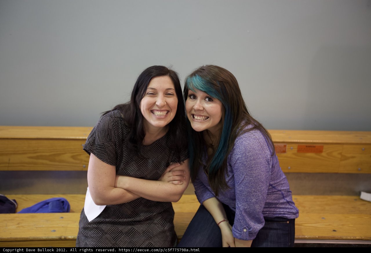 Two Women Enjoying the Wood Bench