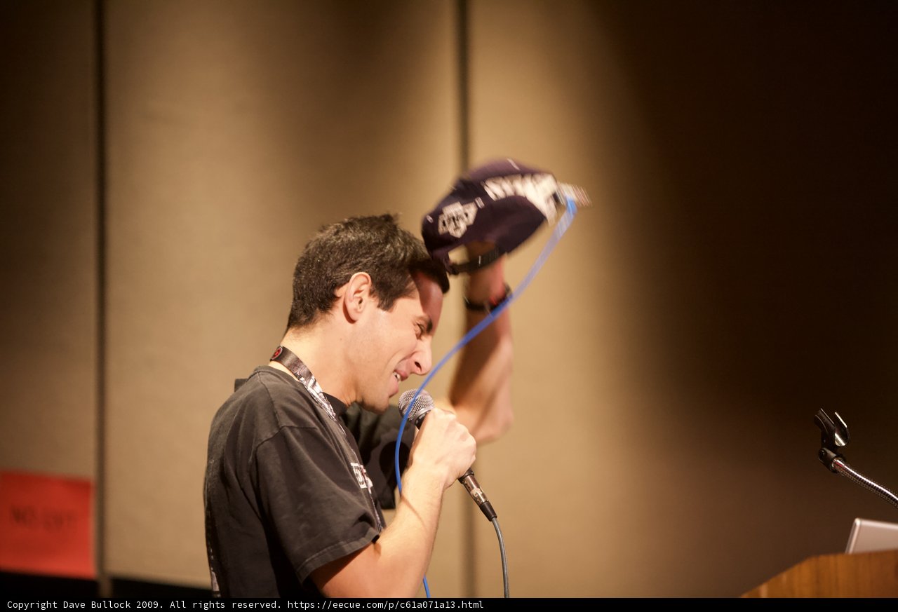 Mic in Hand, Hat on Head
