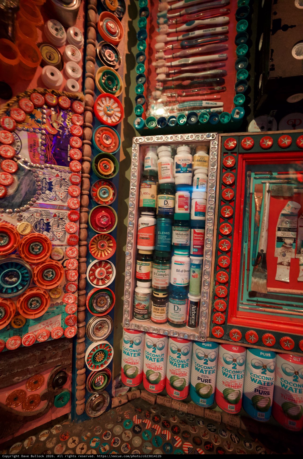 Vibrant Medicine Cabinet Shrine in Eclectic Bottle Cap Art Installation
