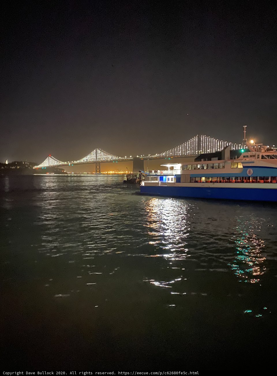 Nighttime Ferry Ride with Cityscape