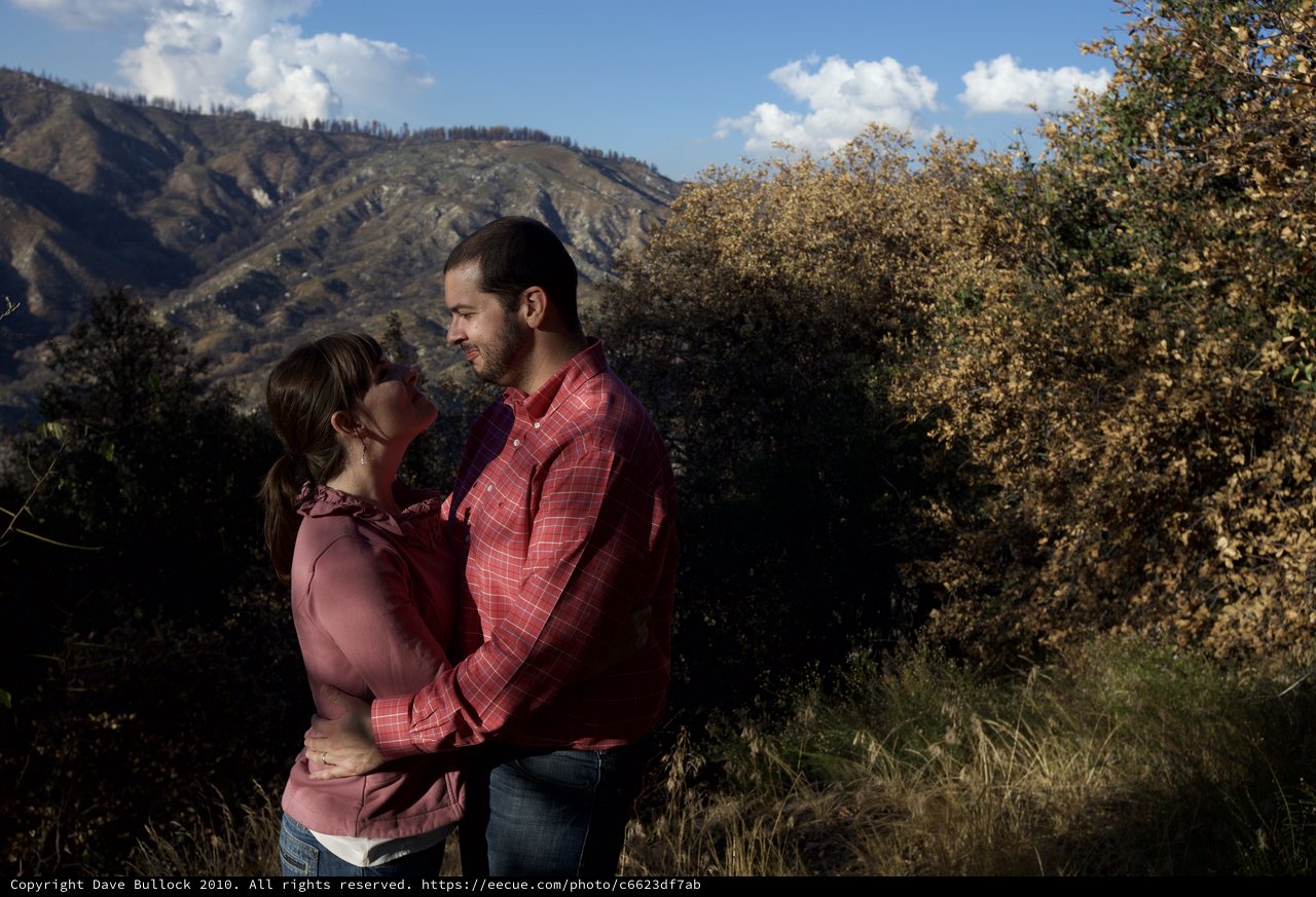 Romantic Couple Embracing in Mountain Wilderness
