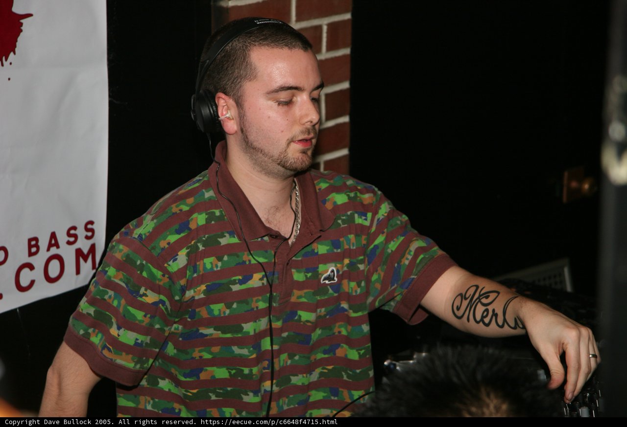 Tattooed DJ Mixing Up a Hit