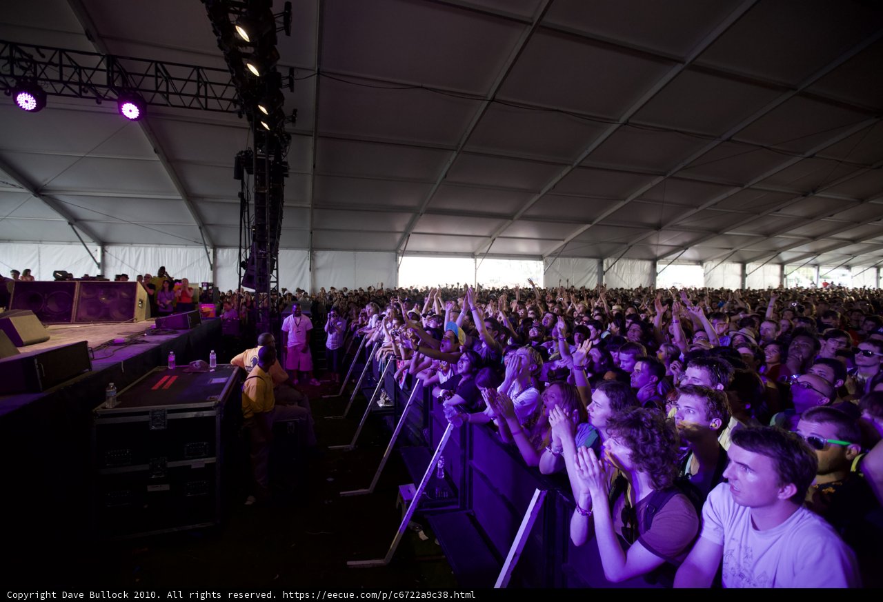 Purple Spotlight on a Jam-Packed Concert Crowd