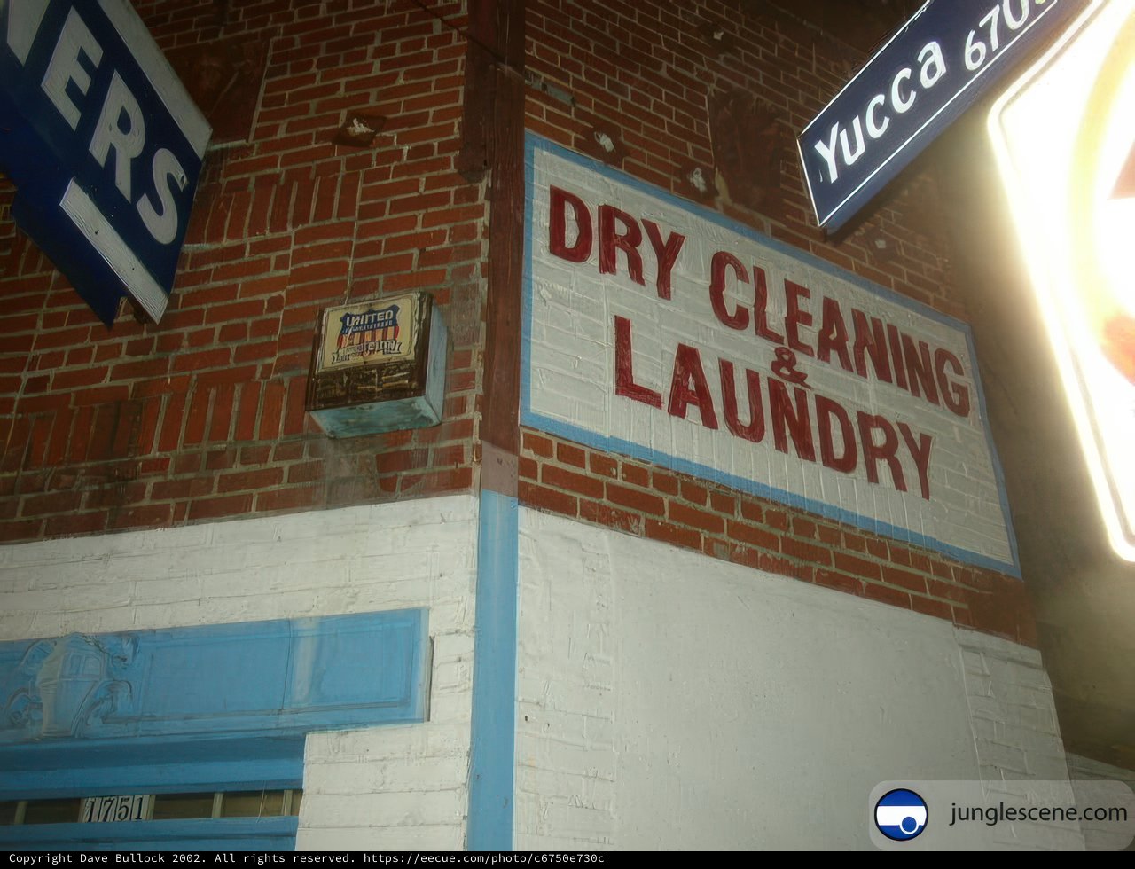 Dry Cleaning Sign on Brick Building