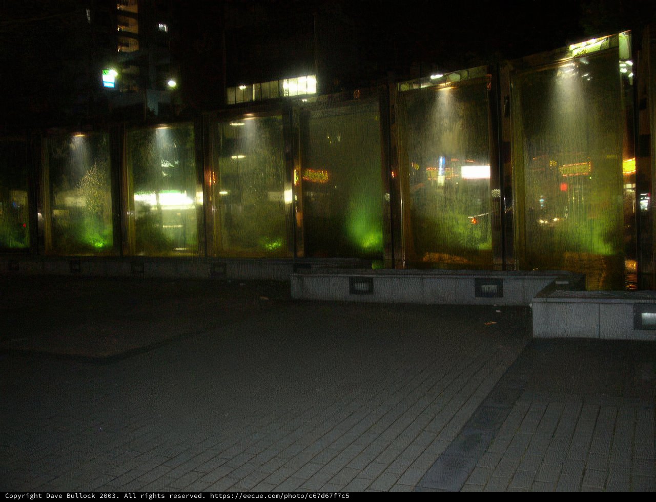 Serene Night at the Green-Lit Fountain