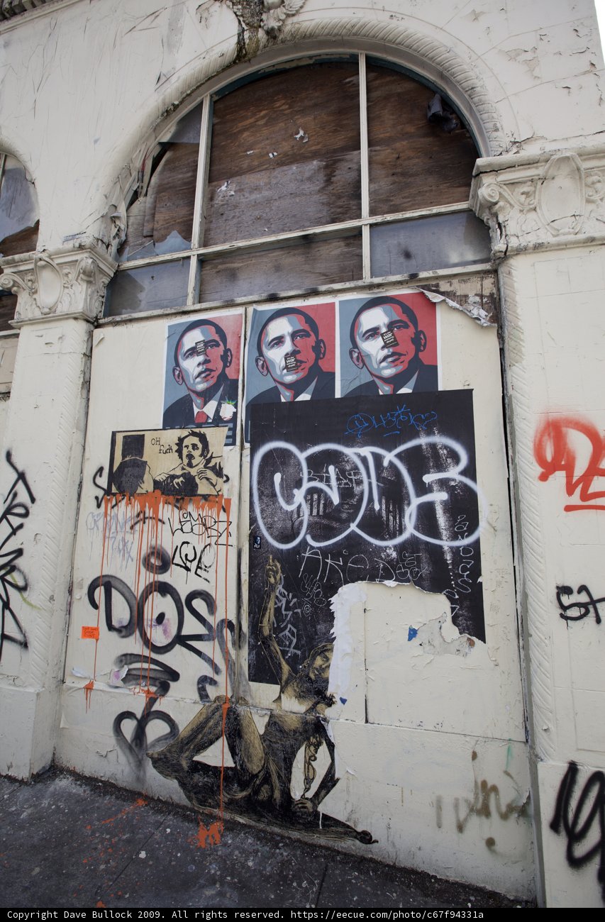 Graffiti on a Building with a Skateboard