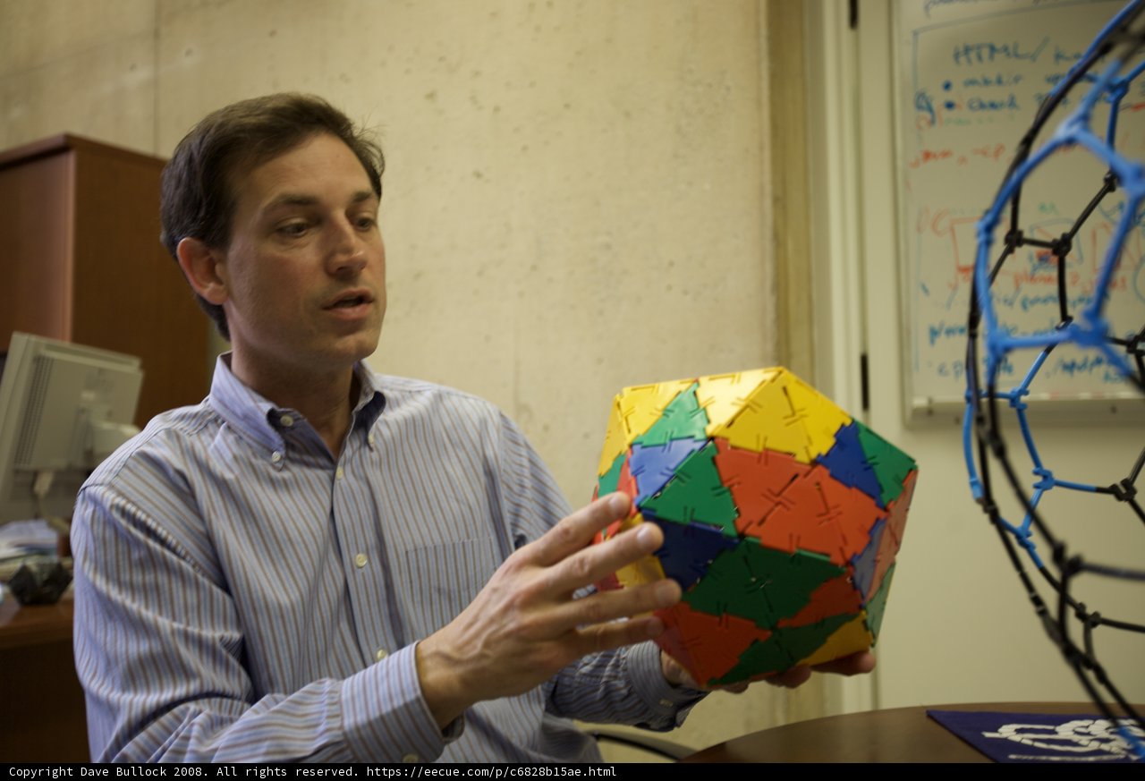 Colorful Sphere in the Hands of a Man