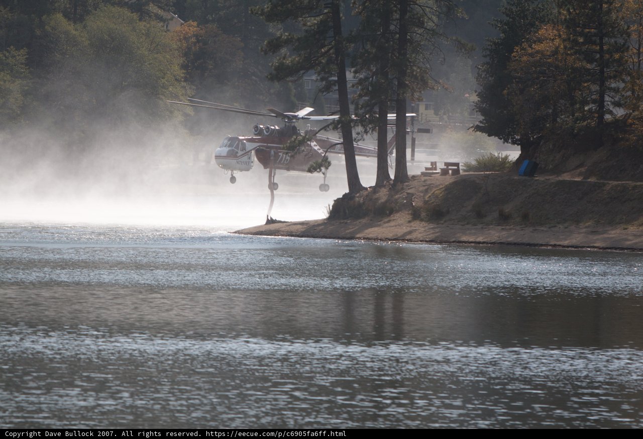 Helicopter Assists Fire Truck Near Lake