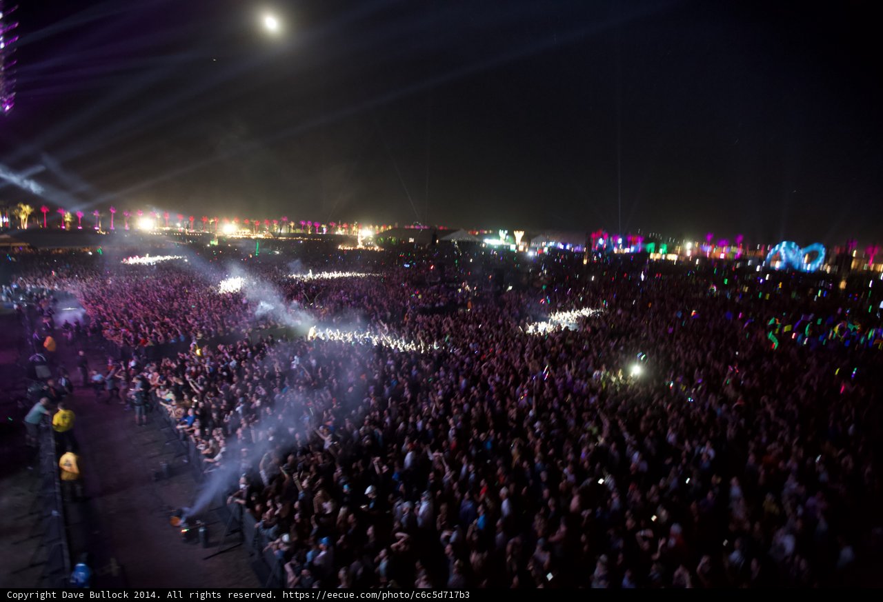 A sea of music lovers under the night sky