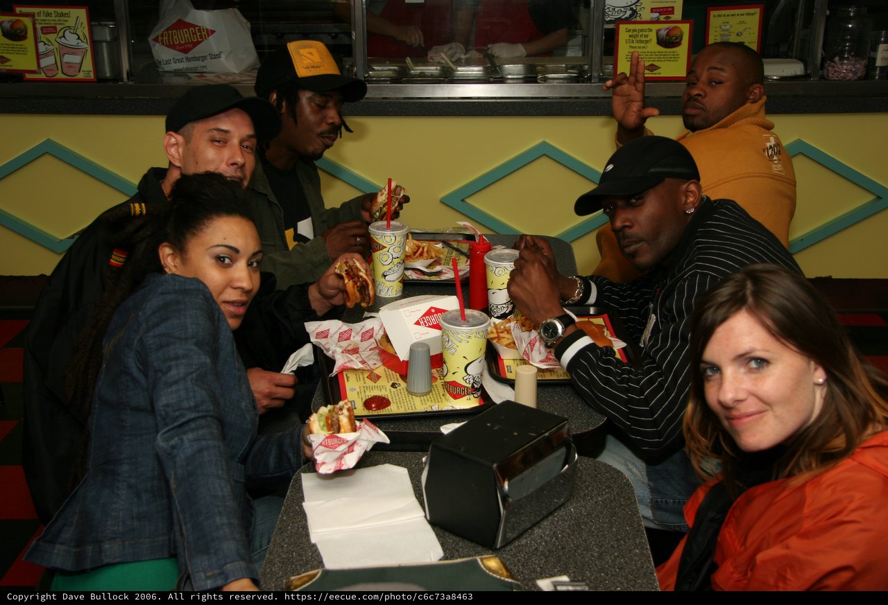 Friends Enjoying Burgers at Fatburger Diner