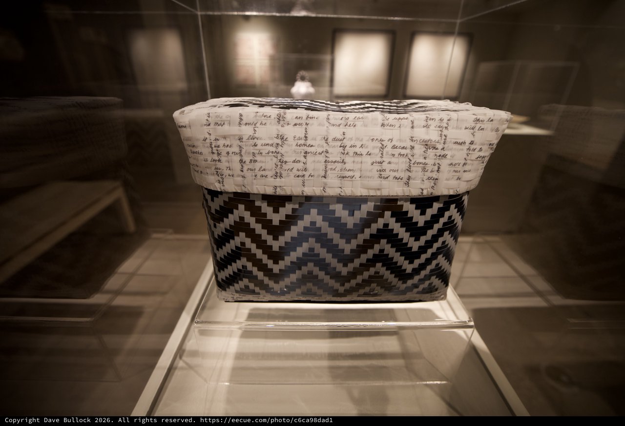 Traditional Woven Basket with Chevron Pattern in Museum Display