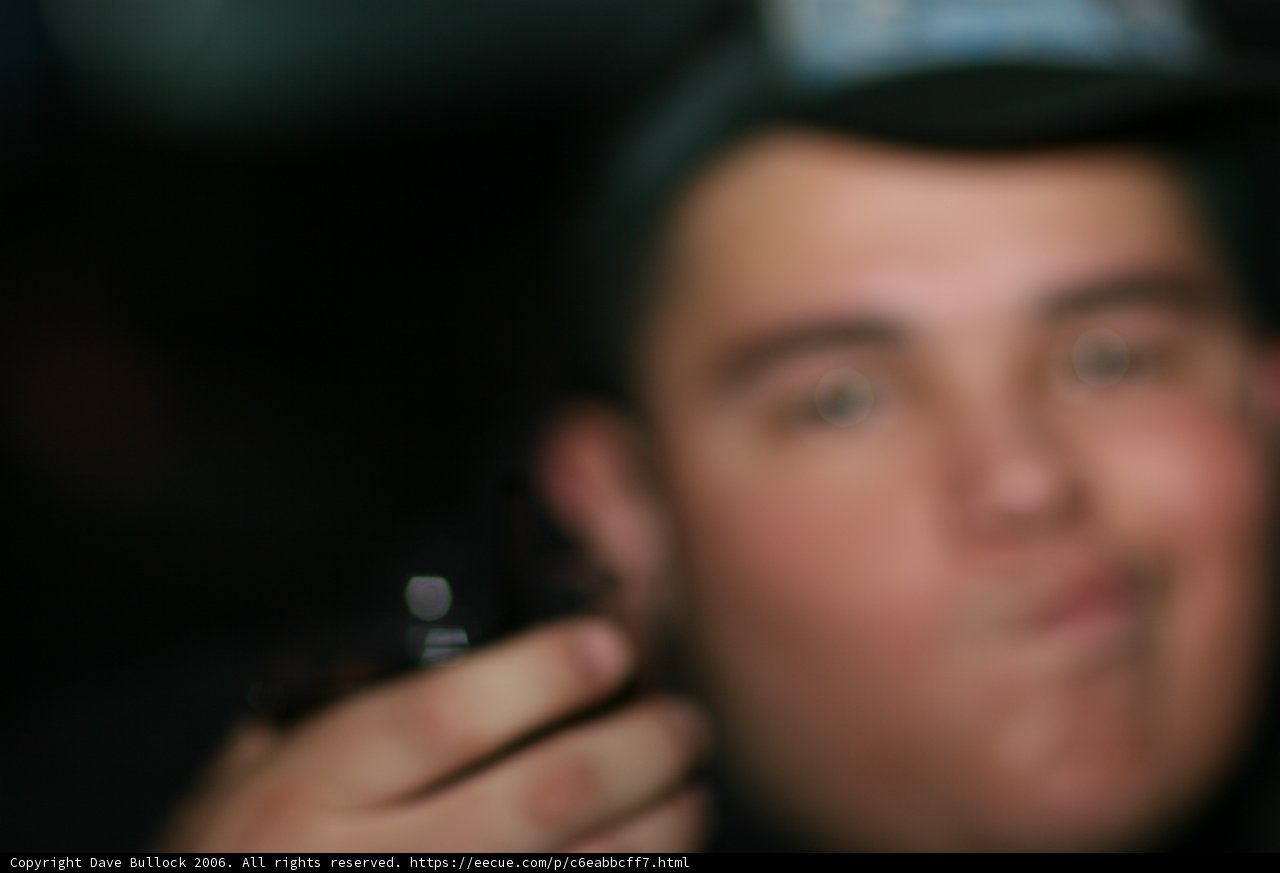 Blurry Man with Cell Phone