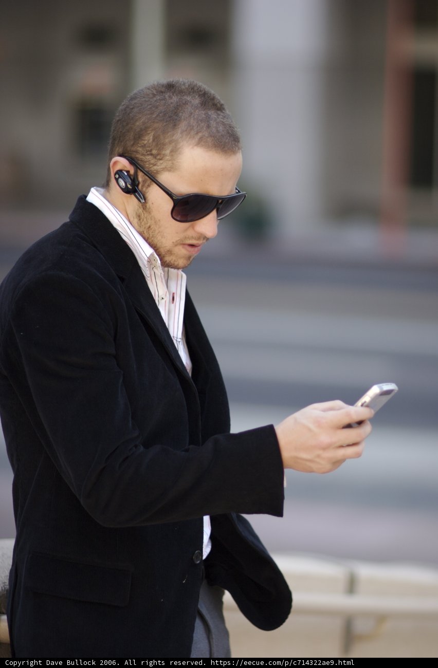 Black Jacket, Sunglasses and Mobile Phone