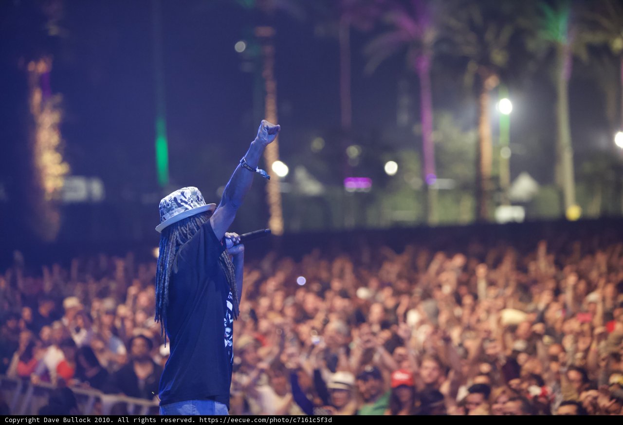 Triumphant Man with Dreadlocks Lights Up Coachella Stage