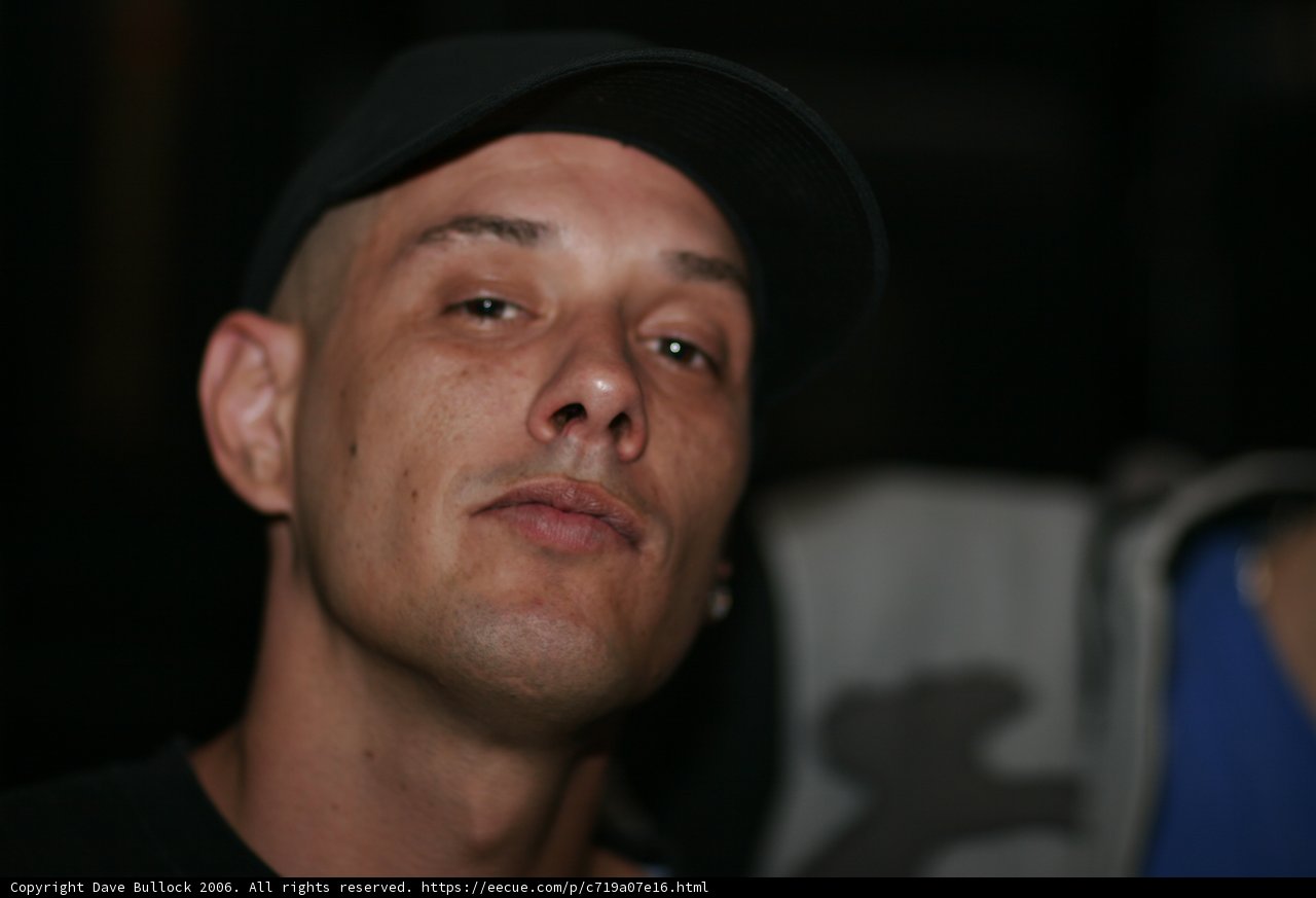 Black-Clothed Man with Baseball Cap