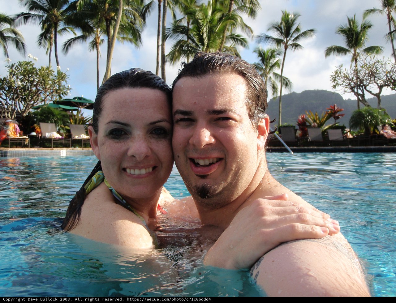 Couple Embracing in Hawaiian Resort Pool