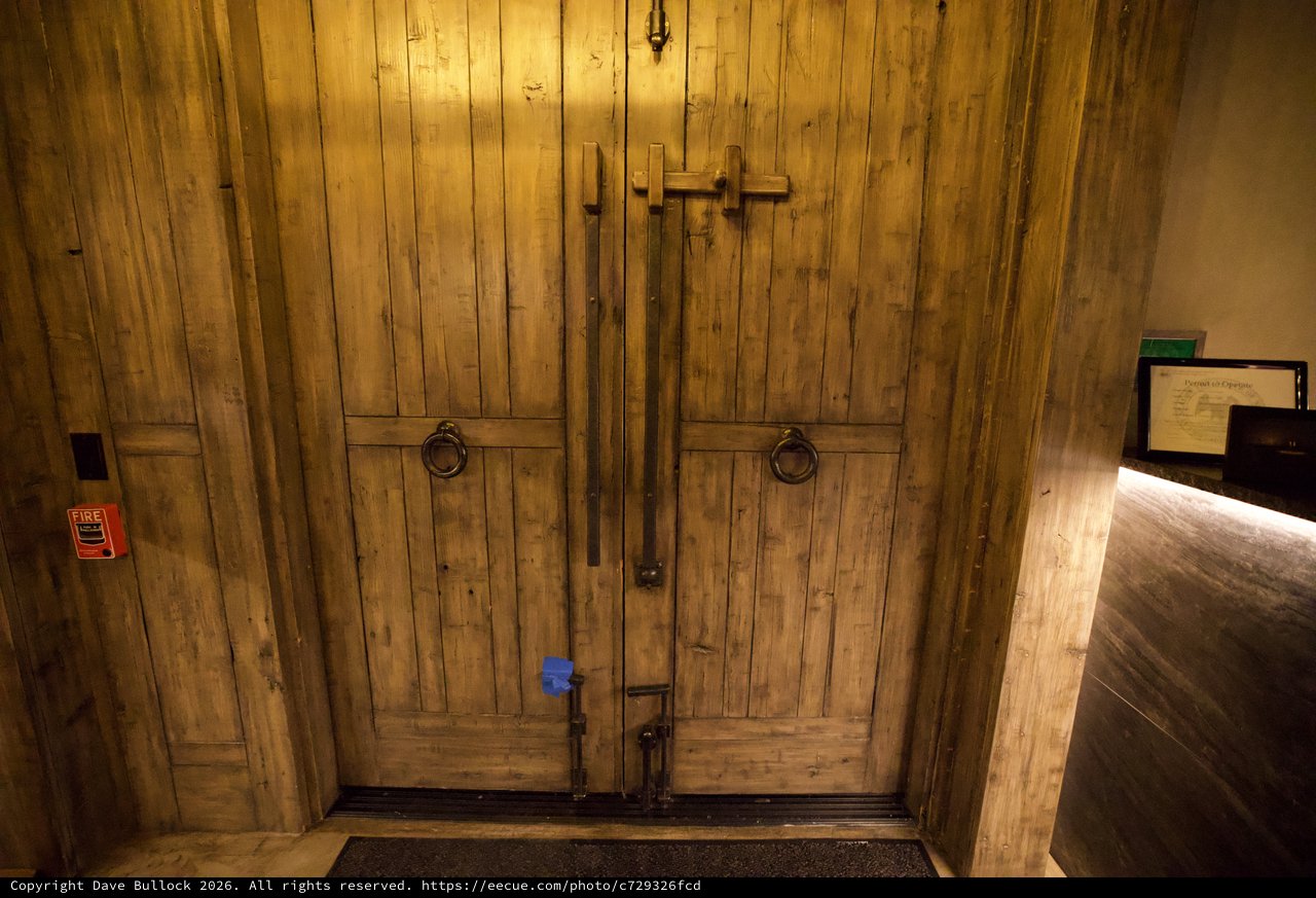 Rustic Wooden Double Doors with Traditional Hardware