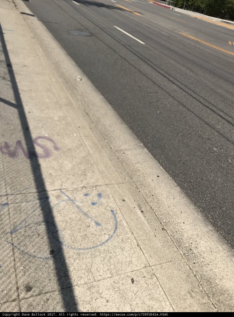 Graffiti and a Car on the Sidewalk