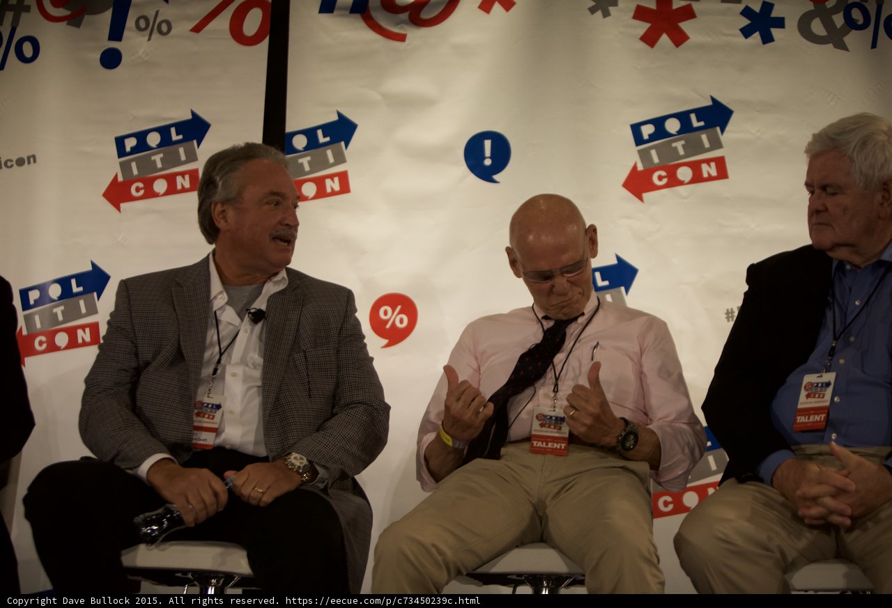 Three Men Engaged in a Press Conference