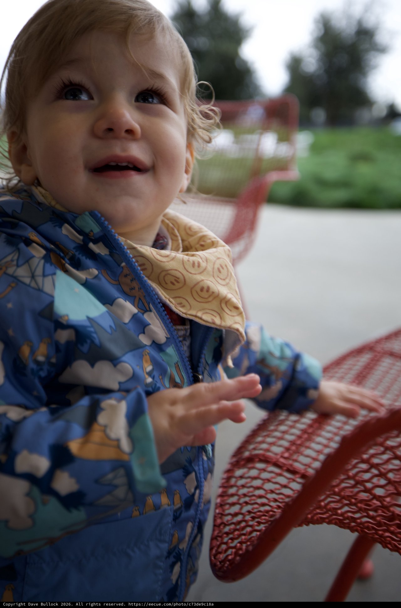 Joyful Toddler at Outdoor Playground on Winter Day