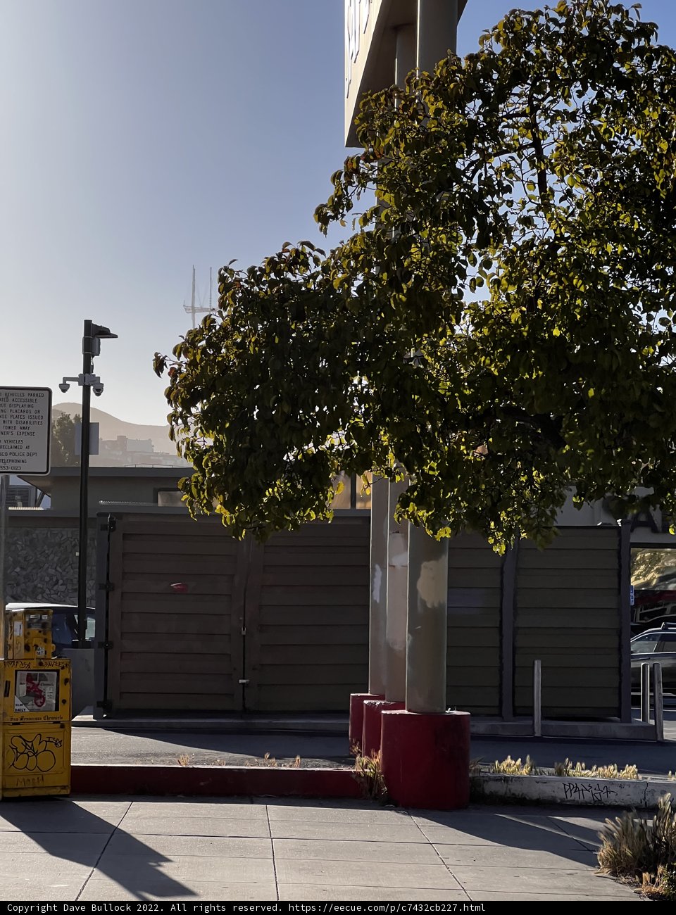 Sunny City Sidewalk with Yellow Fire Hydrant