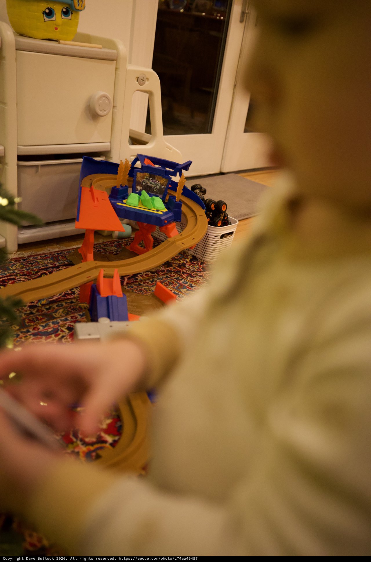 Child Playing with Toy Race Track at Home