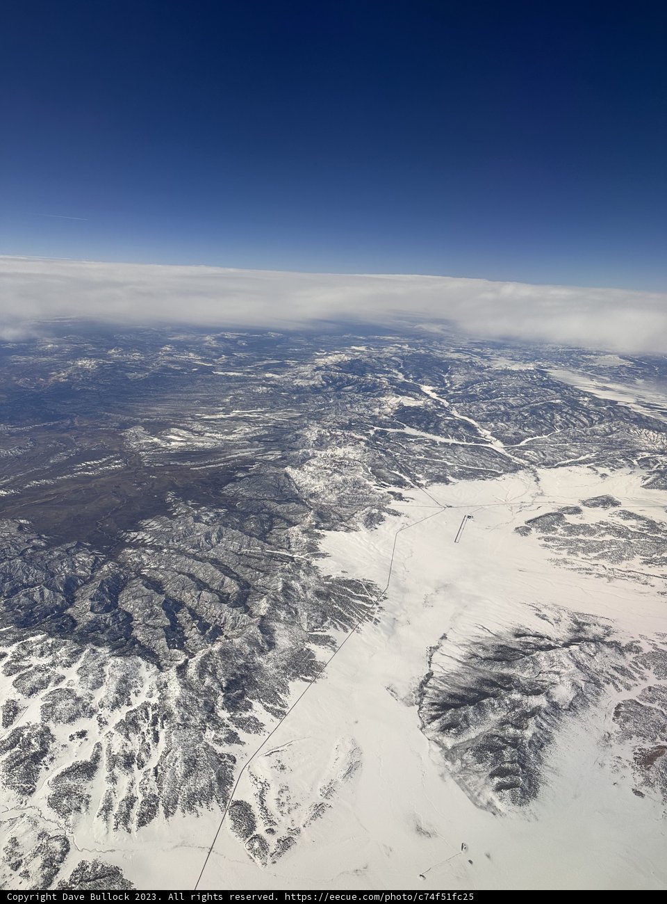 Soaring Over Snowy Peaks