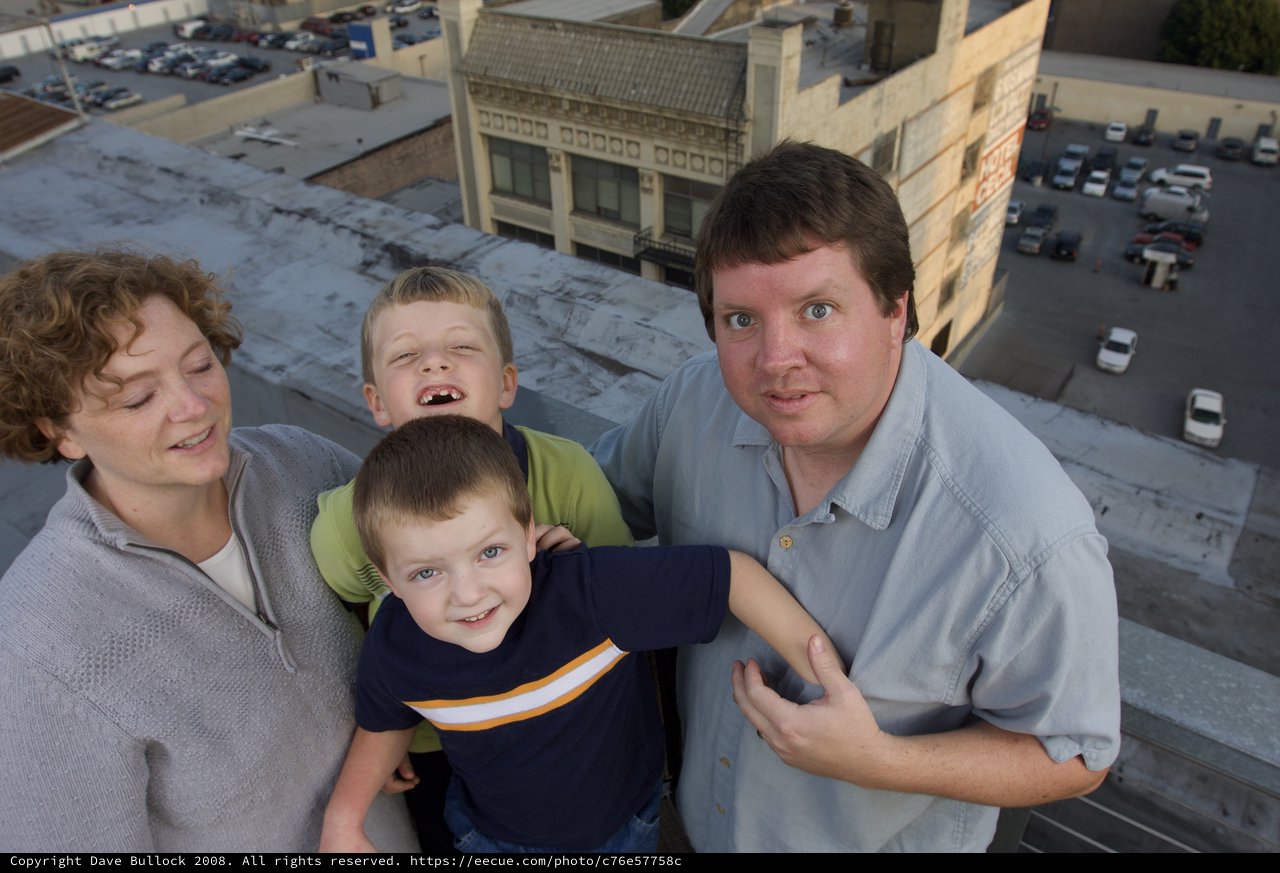Family Portrait on Urban Rooftop at Dusk