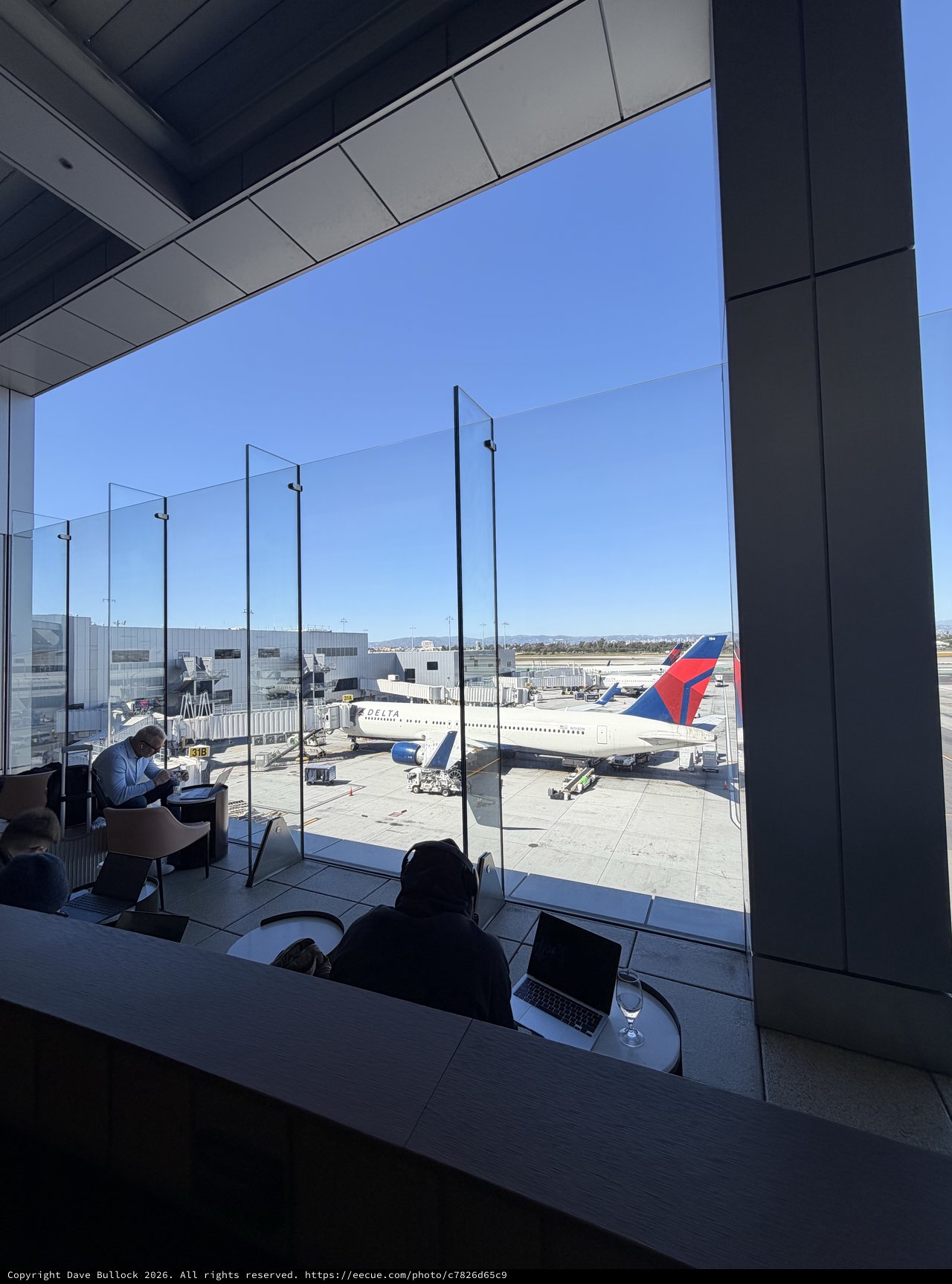 Airport Lounge Workspace with Delta Aircraft on Tarmac