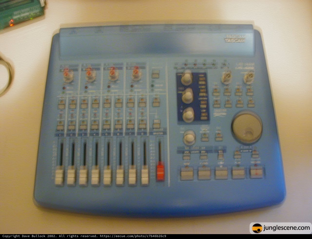 Blue Mixer with Various Knobs and Buttons