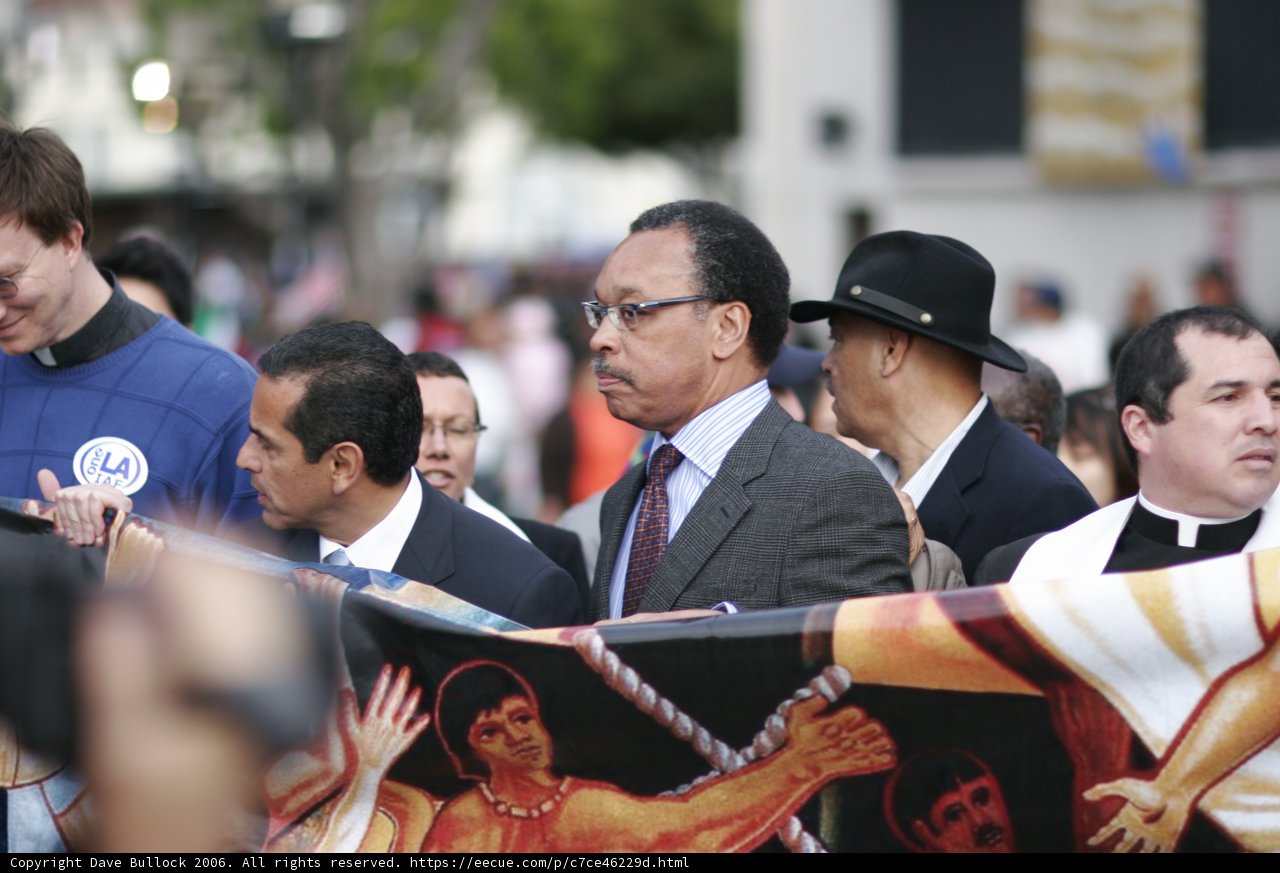 Man in Formal Wear Holding Banner