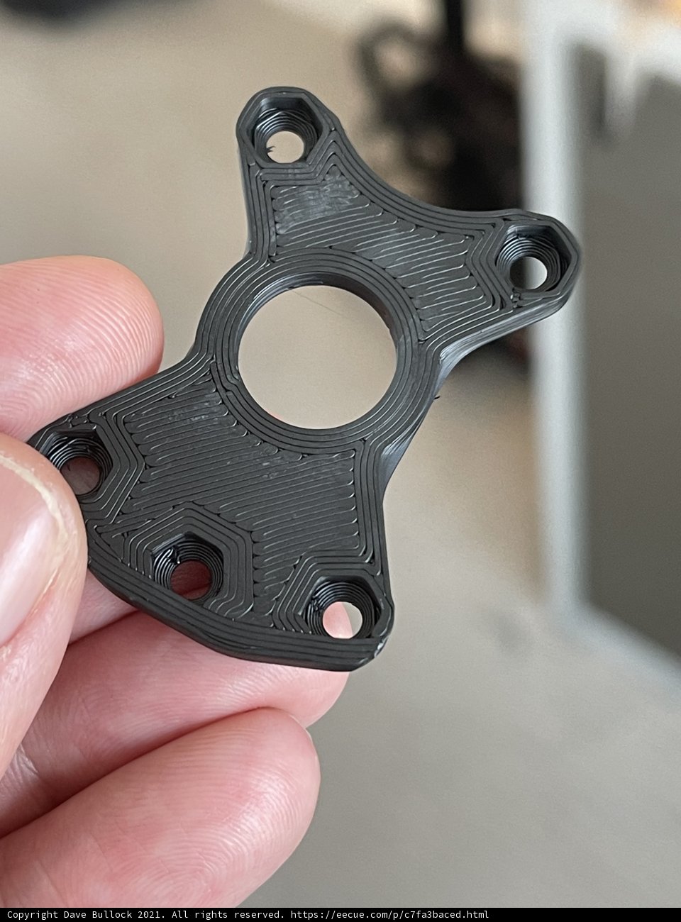 Mysterious plastic piece found among rusty machinery