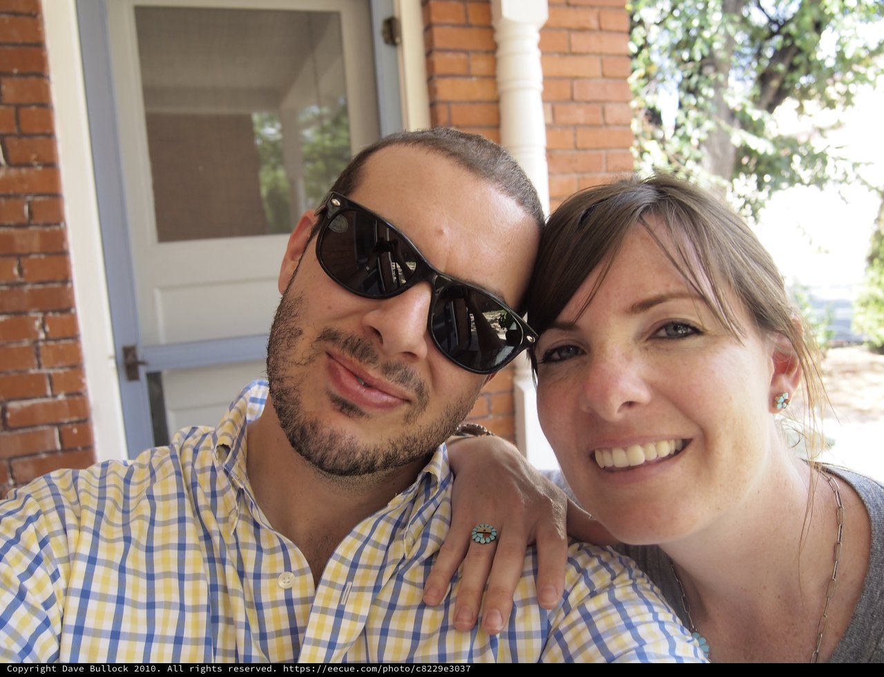 Couple Smiling Together on a Sunny Porch