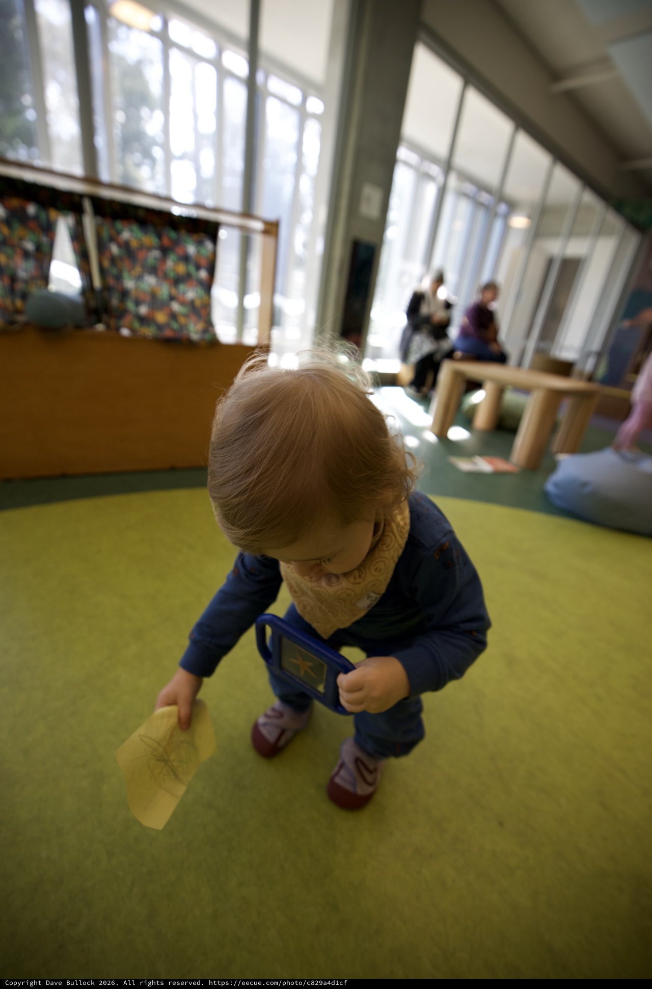 Toddler Exploring Play Space in Bright Indoor Environment