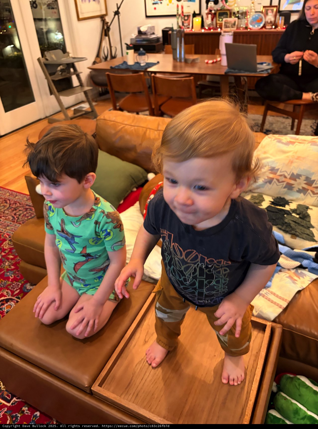 Two Young Boys Playing on Living Room Coffee Table