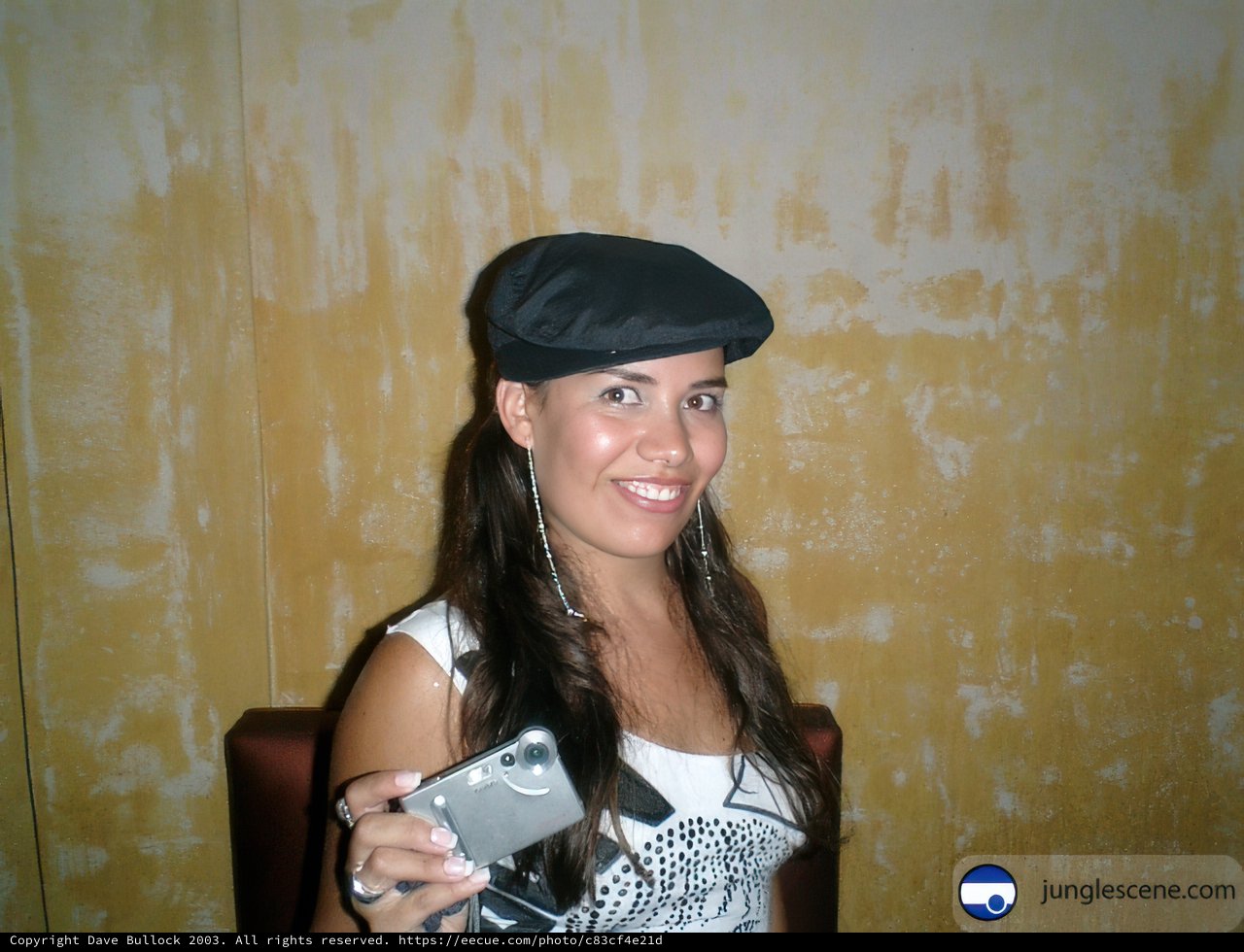 Girl with Phone and Baseball Cap