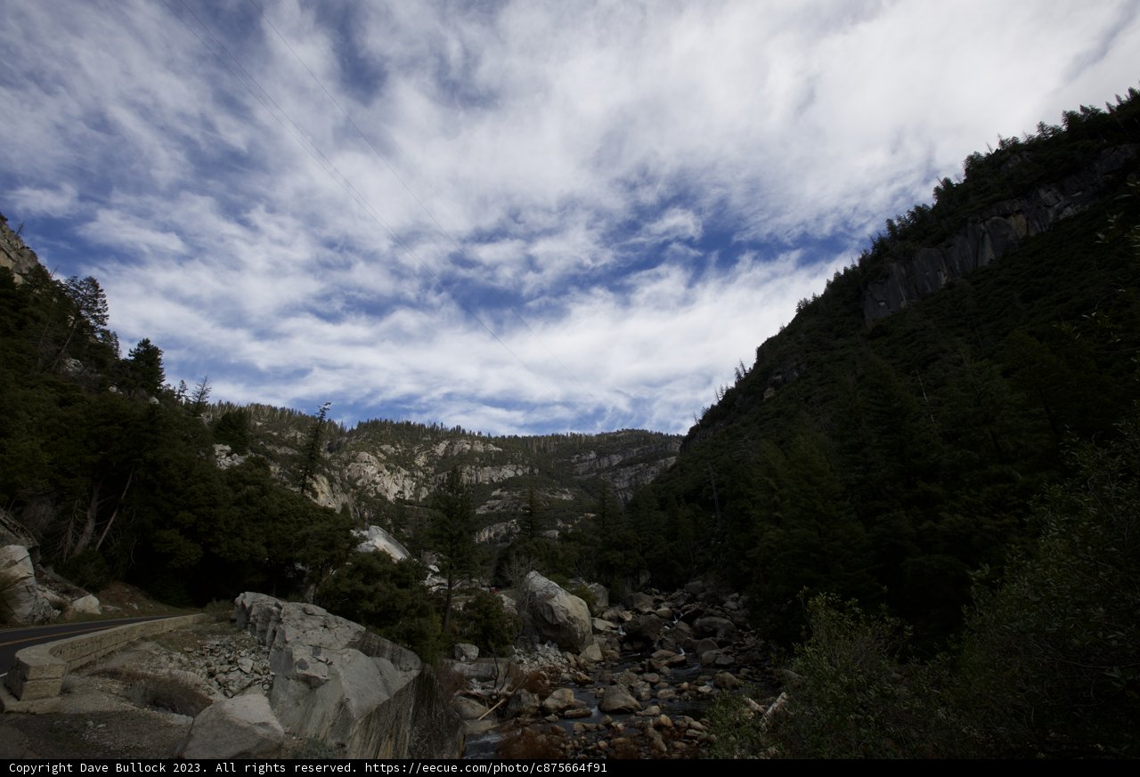 Majestic Frontier: Mountain and River Panorama